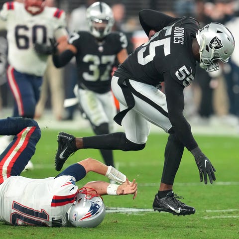 The Raiders' Chandler Jones runs over Patriots qua