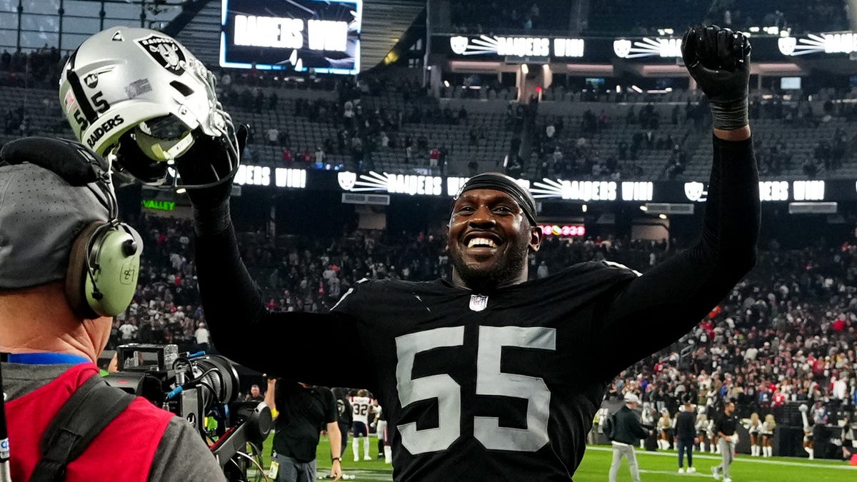 Raiders pass rusher Chandler Jones celebrates after returning a fumble for a touchdown against the New England Patriots at Allegiant Stadium.