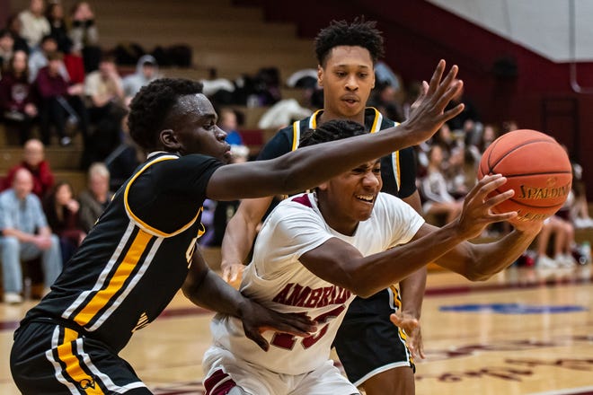 Ambridge's Nino Rideout tries to pass between multiple Quaker Valley players during their game Monday at Ambridge Area High School. [Lucy Schaly/For BCT]