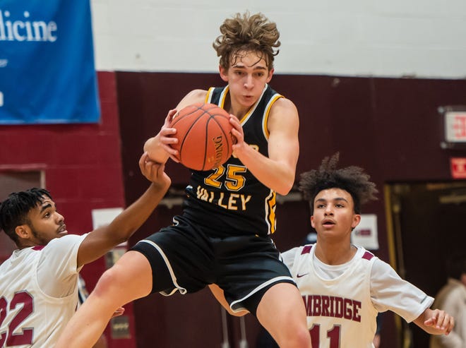 Quaker Valley's Dan Bartels goes up high for a rebound against Ambridge during their game Monday at Ambridge Area High School. [Lucy Schaly/For BCT]