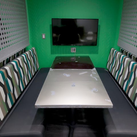 An eating area with tables made out of General Mot