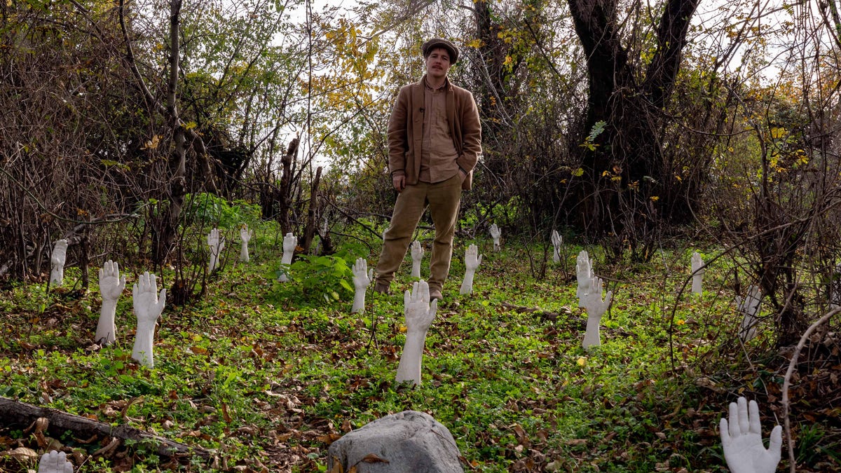 Chateau Chapiteau founder Vanya Mitin stands amid an art installation on the grounds of the commune a few hours northeast of Tbilisi, Georgia. Photo: Nov. 2022.
