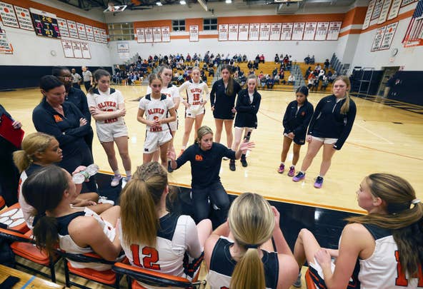 Oliver Ames first-year head coach Brittany Engle talks to her team during a game versus King Philip on Tuesday, Dec. 20, 2022.
