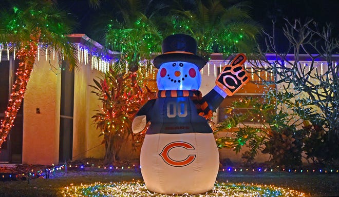 Southwest Florida residents do the best they can with lighted palm trees and inflatable snowmen like this one in Sarasota's Cedar Hollow neighborhood, but cold weather will help it feel more like Christmas this year.
