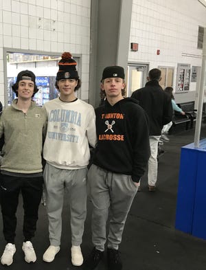 Taunton High School Tigers Co-Captain Connor McGrath and his teammates Colton Scheralis and Dylan McCoughey helped teach Parker Middle School students how to skate at Aleixo Arena on Dec. 19, 2022.