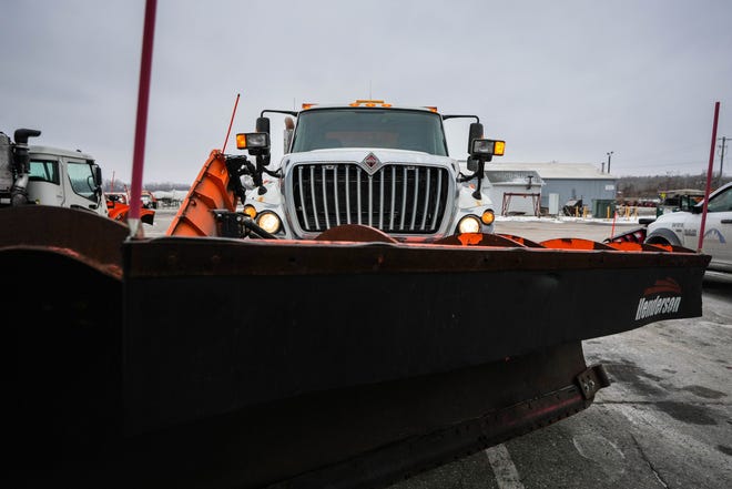 A snowplow sits in the Des Moines city public works lot Wednesday, ready for the upcoming blizzard.