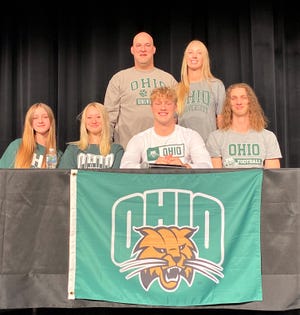 Bloom-Carroll senior Andrew Marshall, surrounded by his family, made it official by signing his National Letter of Intent to play college football at Ohio University.
