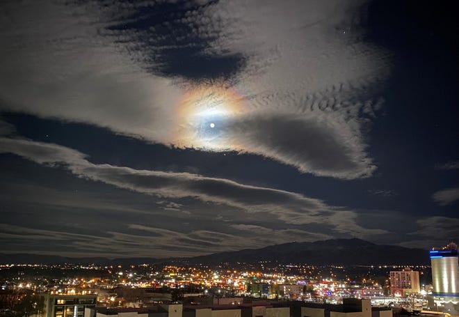 A Dec. 8, 2022 photo of the "cold moon"  from downtown Reno looking west. It was the last full moon of 2022. It is called the cold  moon to signify cold nights that are ahead.