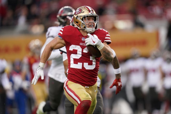 San Francisco 49ers running back Christian McCaffrey (23) runs for a 38-yard touchdown against the Tampa Bay Buccaneers at Levi's Stadium.