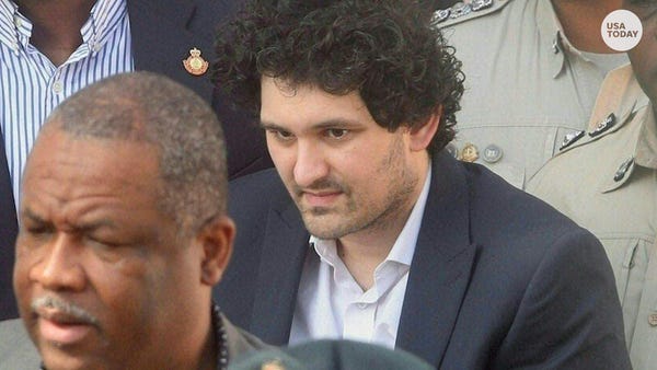 SBF in US custody as two former executives plead g