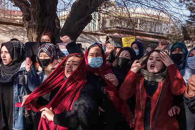Afghan women chant slogans to protest against a Taliban order banning university education for women in Kabul, Afghanistan, on Dec. 22, 2022.