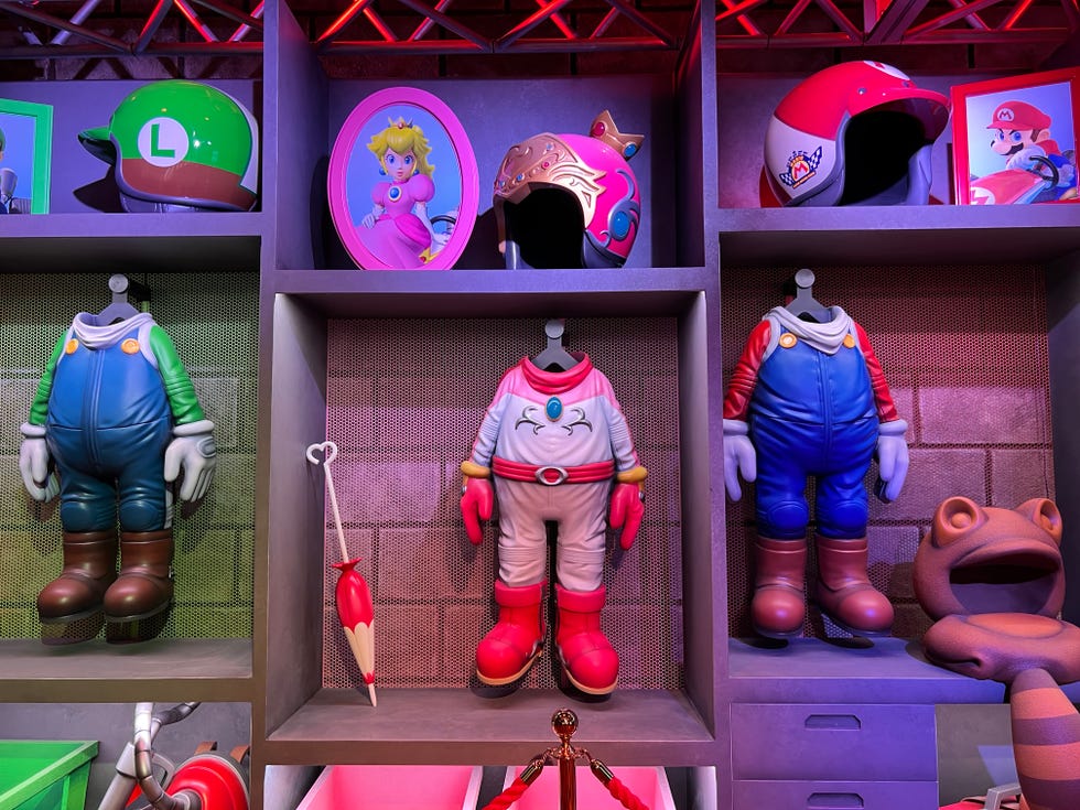 Just before they get on the Mario Kart ride, guests pass through the "locker room" with the suits of various characters hang.