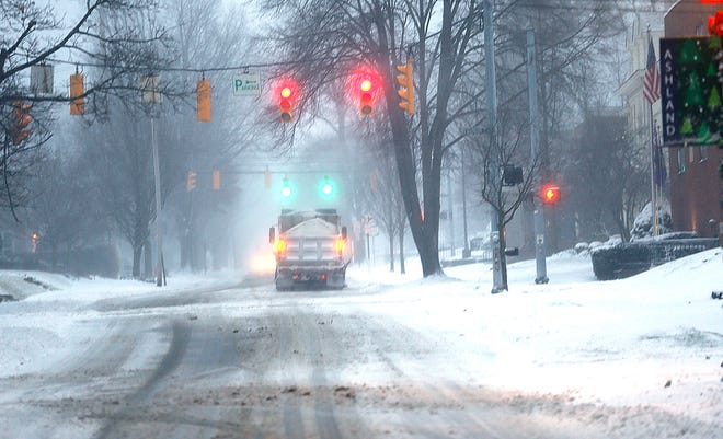 A City of Ashland snow plow heads south on Center Street working to clear the streets as winter storm Elliott hit Ashland Friday, Dec. 23, 2022. TOM E. PUSKAR/ASHLAND TIMES-GAZETTE