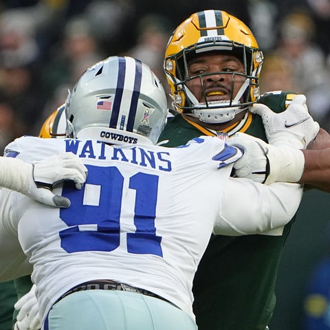 Green Bay Packers guard Elgton Jenkins (74) blocks
