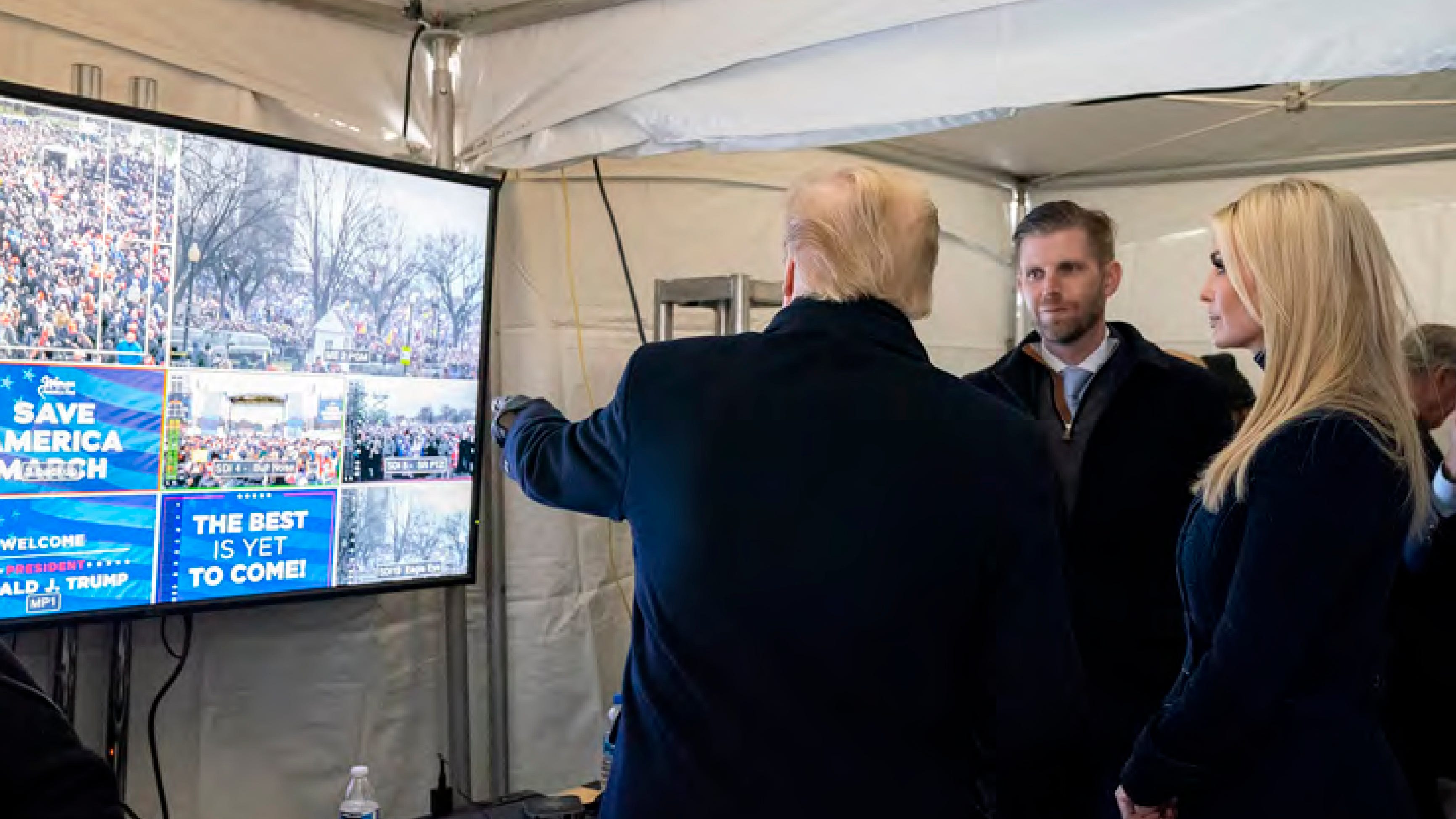 In this image released in the final report by the House select committee investigating the Jan. 6 attack on the U.S. Capitol, on Thursday, Dec. 22, 2022, President Donald Trump looks at video monitors showing the crowd gathered on the Ellipse on the morning of Jan. 6, 2021, before he spoke. At rights is Ivanka Trump and second from right is Eric Trump.