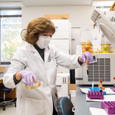 Lab manager Rita Smith processes blood samples as 