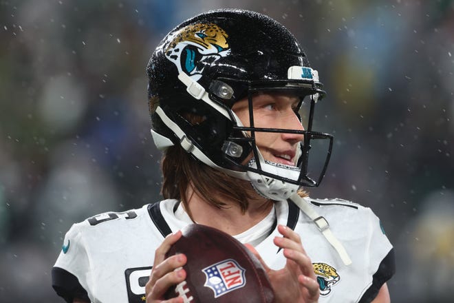 Jacksonville Jaguars quarterback Trevor Lawrence (16) throws a pass during a break in the first half against the New York Jets at MetLife Stadium.