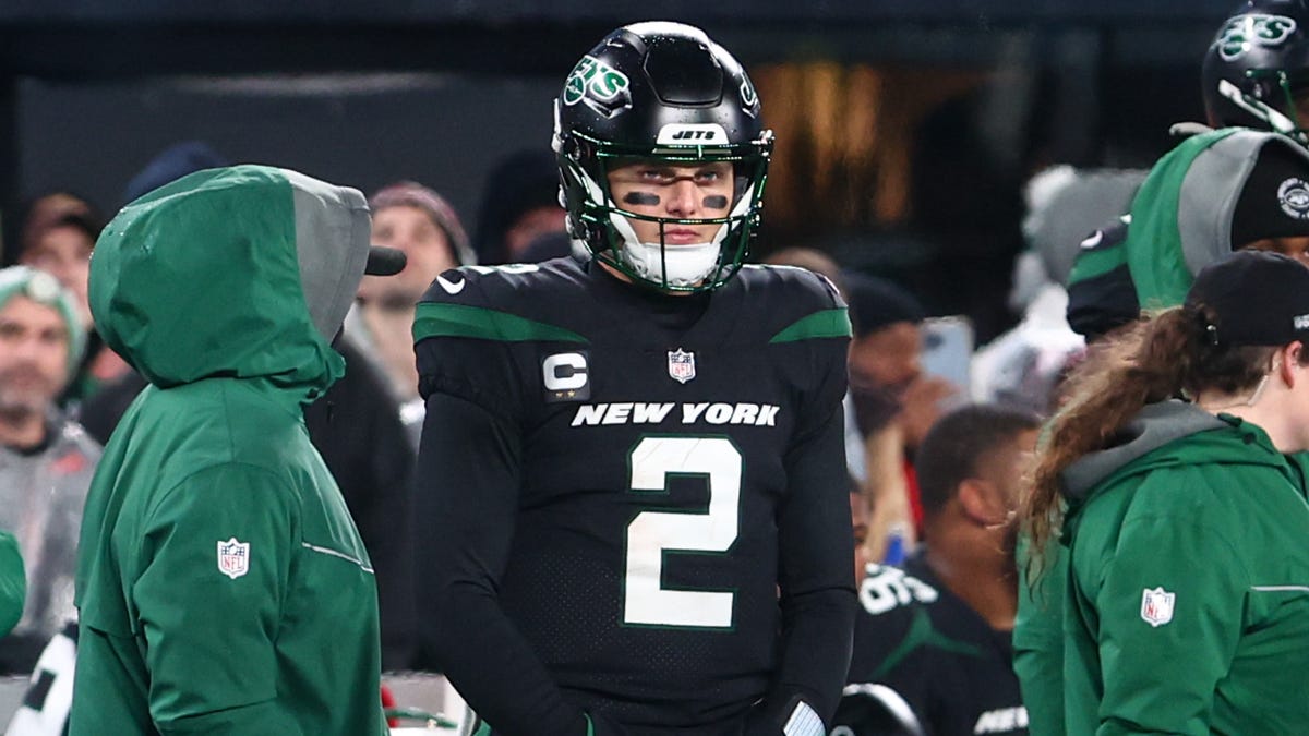 New York Jets quarterback Zach Wilson watches from the sideline after he was benched against the Jacksonville Jaguars.