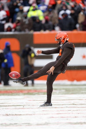 Cleveland Browns punter Corey Bojorquez punts during the first half of an NFL football game against the New Orleans Saints, Saturday, Dec. 24, 2022, in Cleveland. (AP Photo/Ron Schwane)