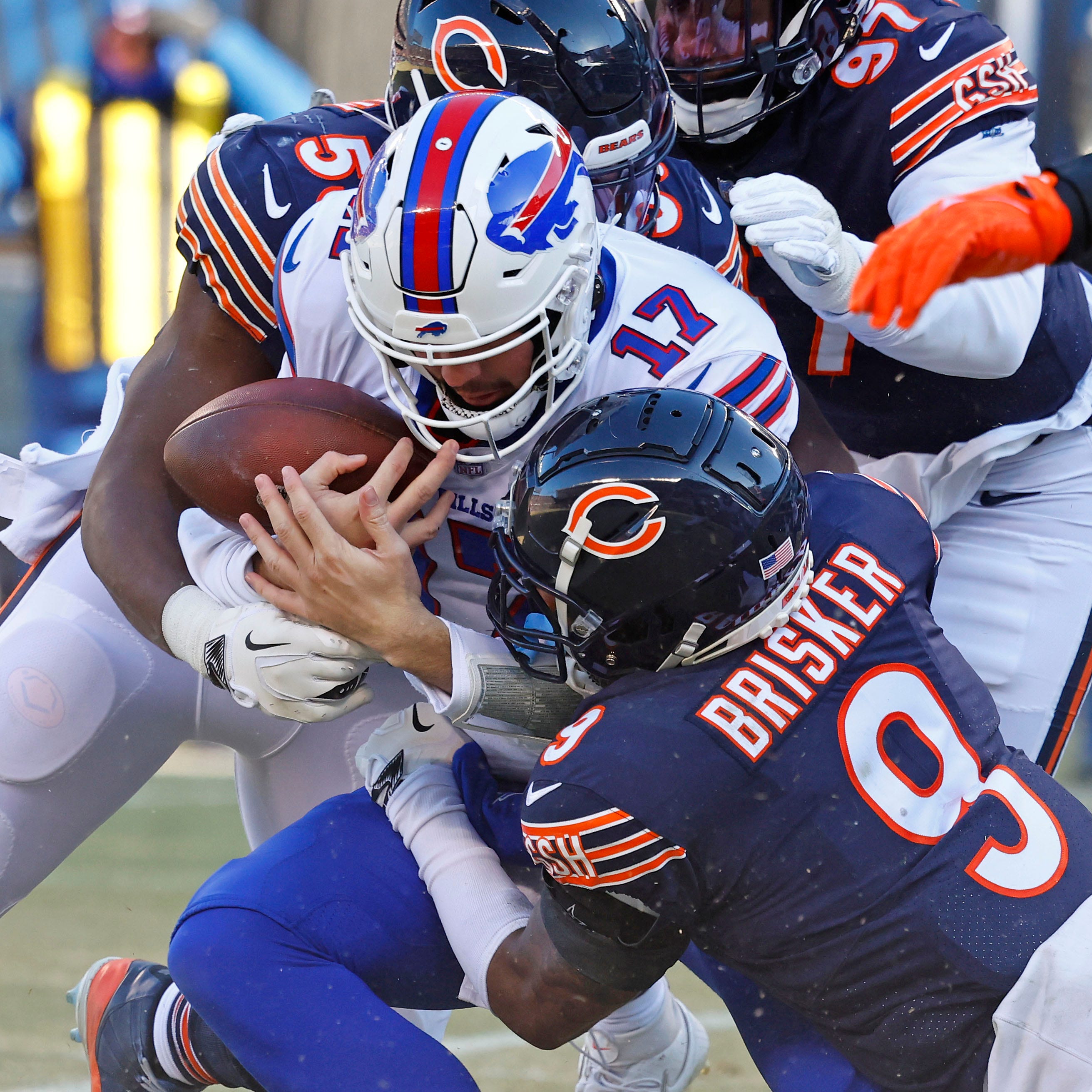 Bears safety Jaquan Brisker (9) sacks Bills quarterback Josh Allen during the second quarter at Soldier Field in Chicago on Dec. 24, 2022.