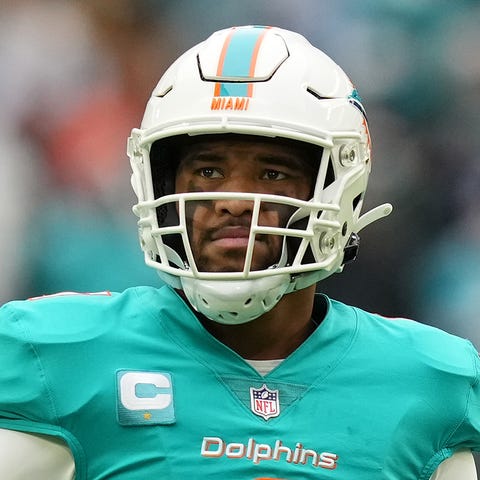 Miami Dolphins quarterback Tua Tagovailoa stands o