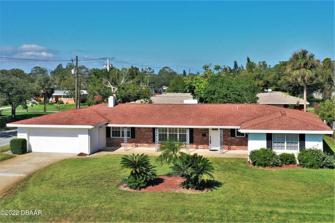 This four-bedroom, three-full-bath home sits on a corner lot, perched high above the street in the heart of one of the most sought-after beachside neighborhoods in Ormond Beach.