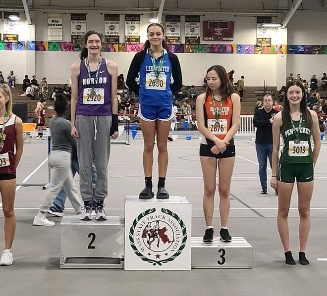 Leominster's Diamani Canuto sits atop the podium after winning the high jump at the MSTCA Boston Holiday Challenge on Tuesday at the Reggie Lewis Center.