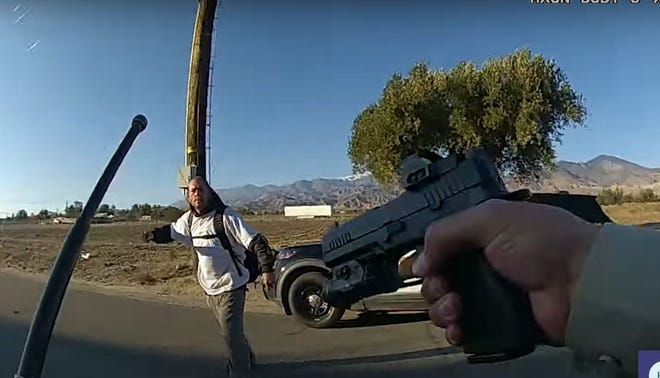 A frame from a Riverside County sheriff's deputy's body-worn camera shows Kenneth Wallis waving a knife moments before the deputy shot and killed him in Cabazon on Nov. 12.