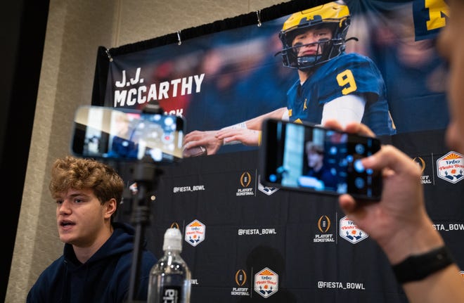 JJ McCarthy, Michigan quarterback, answers questions during the Fiesta Bowl press conference at the Arizona Ballroom at the Camelback Inn in Paradise Valley, Arizona on December 27, 2022.