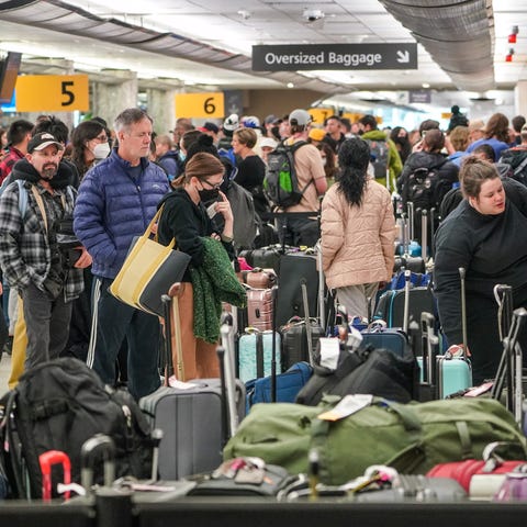 Bags at Denver International Airport sit awaiting 