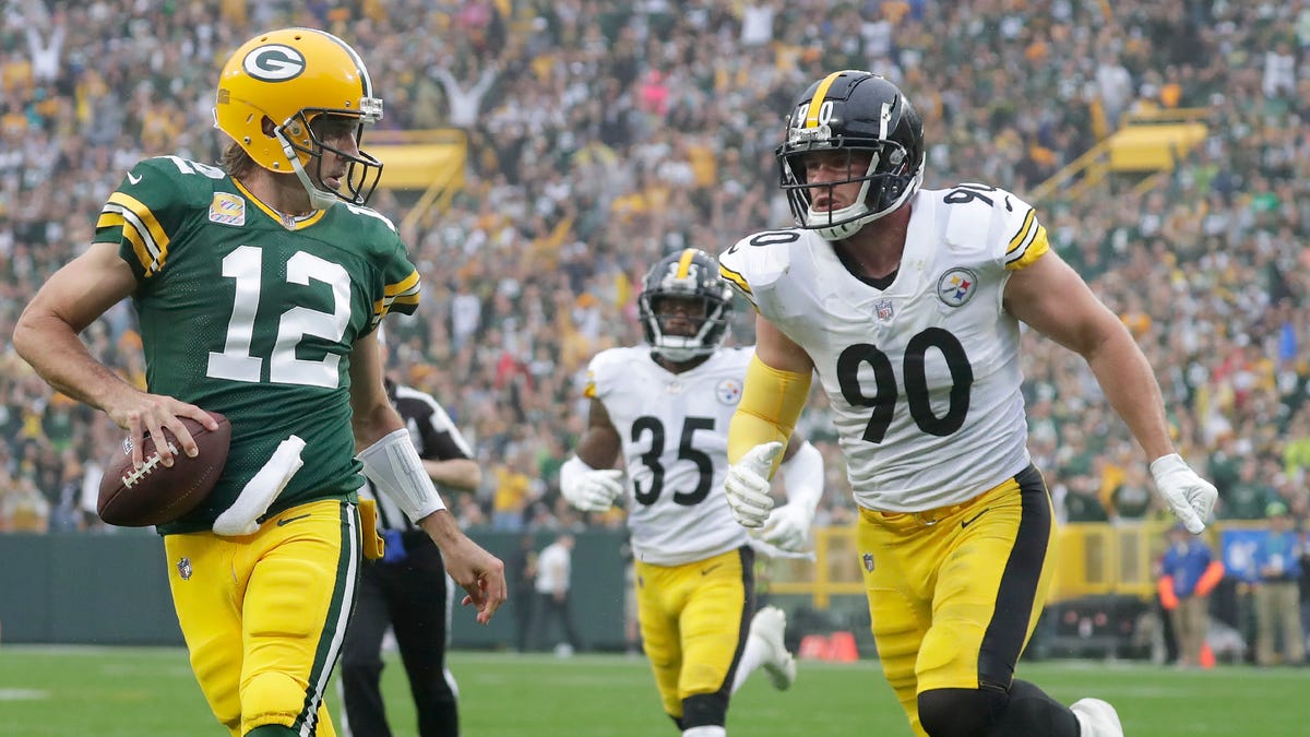 Packers QB Aaron Rodgers and Steelers OLB T.J. Watt (90) might yet reach the playoffs.