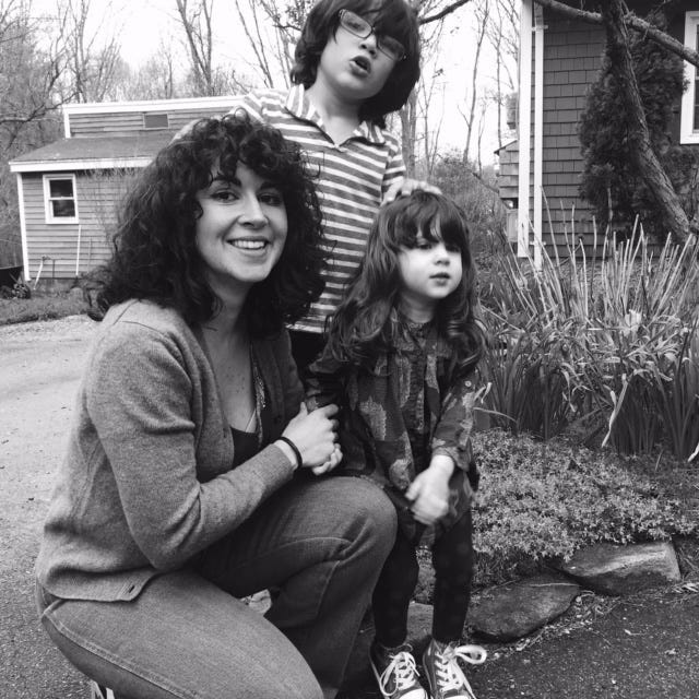 Claudia De Sousa-Baptista (left) poses with her two children.
