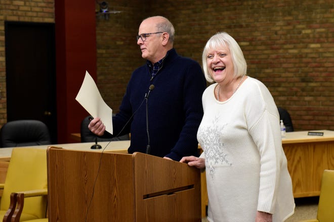 Auditor Joyce Schifer shares a laugh with Mayor Jeff Reser during her retirement party Wednesday at city hall.