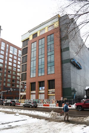 Construction is underway on the MSU Federal Credit Union downtown East Lansing office building on Dec. 28, 2022.