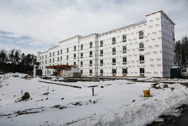 Construction is underway for the WoodSpring Suites extended-stay hotel in East Lansing on Dec. 28, 2022.