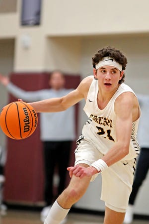 Freshman star Joe Sterling (21) of Crespi High School, a 6-foot-3 guard, controls the ball against Davis High of Utah during the Desert Holiday Classic in Rancho Mirage, Calif., on Tuesday, Dec. 27, 2022. 