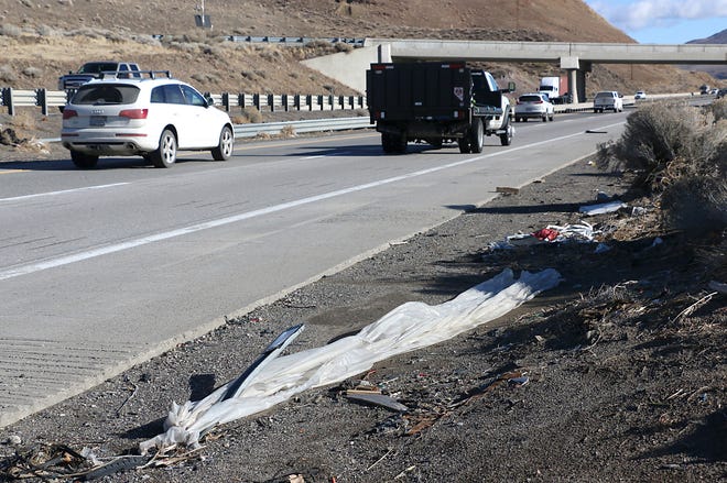Trash is seen along I-80 near the Lockwood exit east of Reno on Dec. 28, 2022.