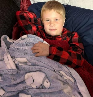 Andrew Miller, 8, a second-grader of Conesville Elementary School is currently undergoing radiation treatments for two types of cancer in his brain and stomach at Akron Children's Hospital.