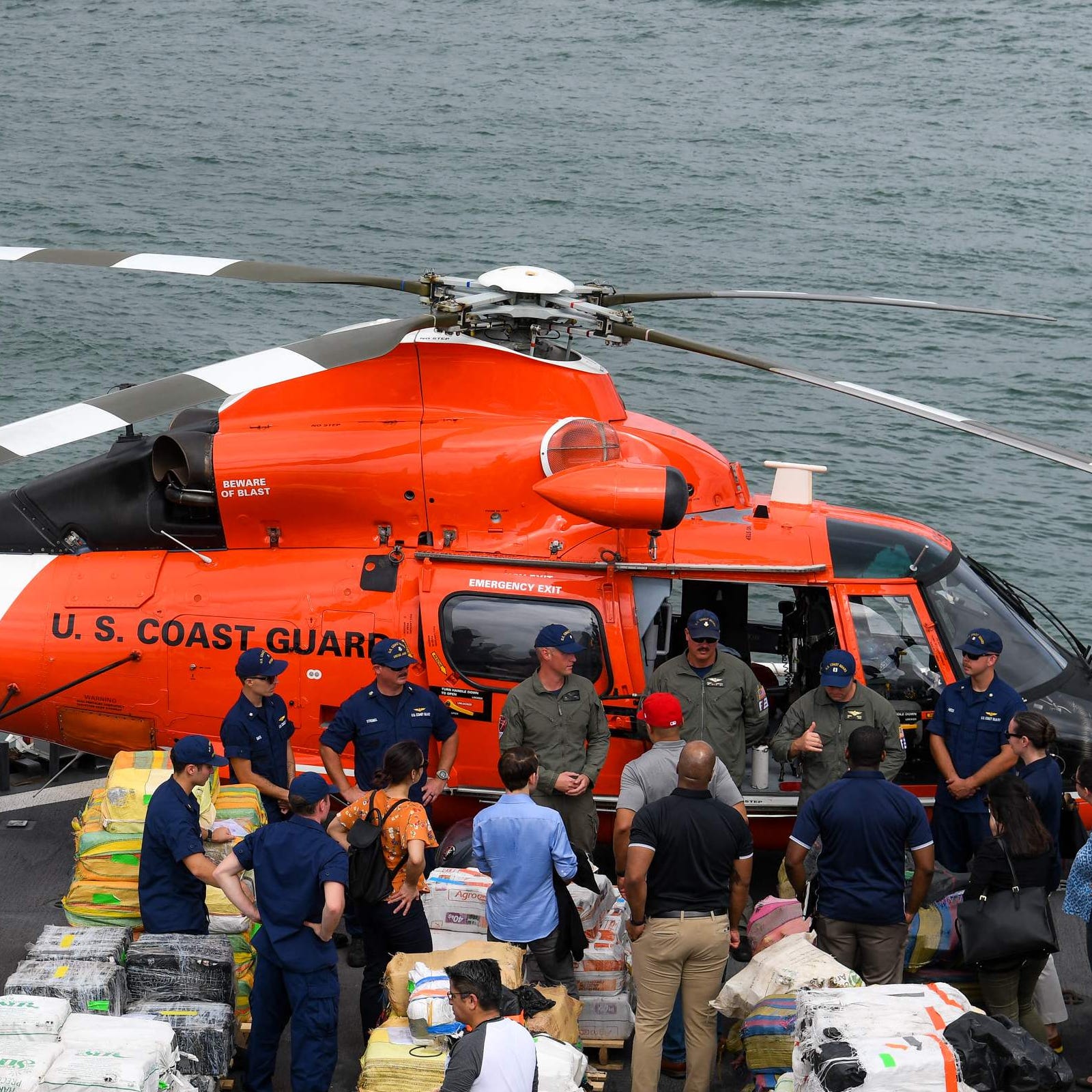 US Coast Guard personnel are pictured standing on the deck of Cutter James.