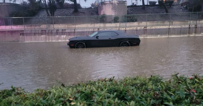 A car is seen in deep waters on Saturday, Dec. 31, 2022 in Stockton.