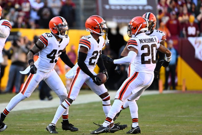 Jan 1, 2023; Landover, Maryland, USA; Cleveland Browns cornerback Denzel Ward (21) reacts after and interception against the Washington Commanders during the first half at FedExField. Mandatory Credit: Brad Mills-USA TODAY Sports