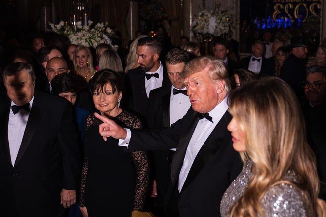 Former President Donald Trump and wife Melania Trump are seen inside the Mar-a-Lago Ballroom on New Year's Eve in Palm Beach, Florida, Saturday, December 31, 2022.