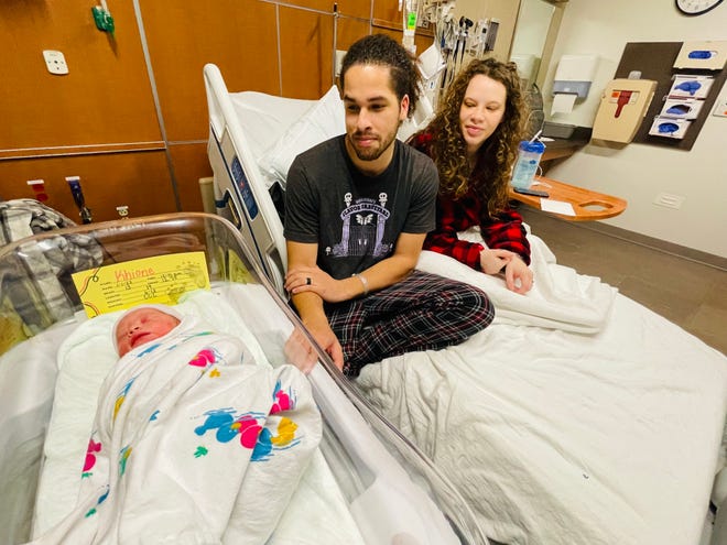 Proud parents Athena Hadder and JC Harris watch over their daughter Khione, the first baby of 2023 born at CarolinaEast Medical Center in New Bern.