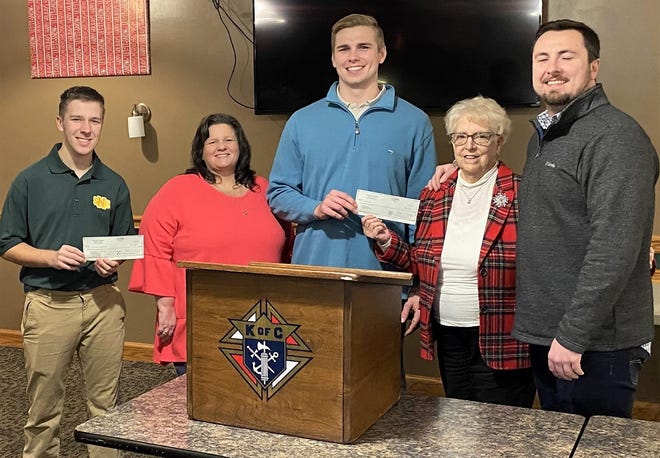 Knights of Columbus Council 505 members Patrick Maxwell, Aaron Parry and Dylan Parry present checks for $760 to Caribeth Legats of the Miracle League and Bonnie Burns of the National Alliance on Mental Health.