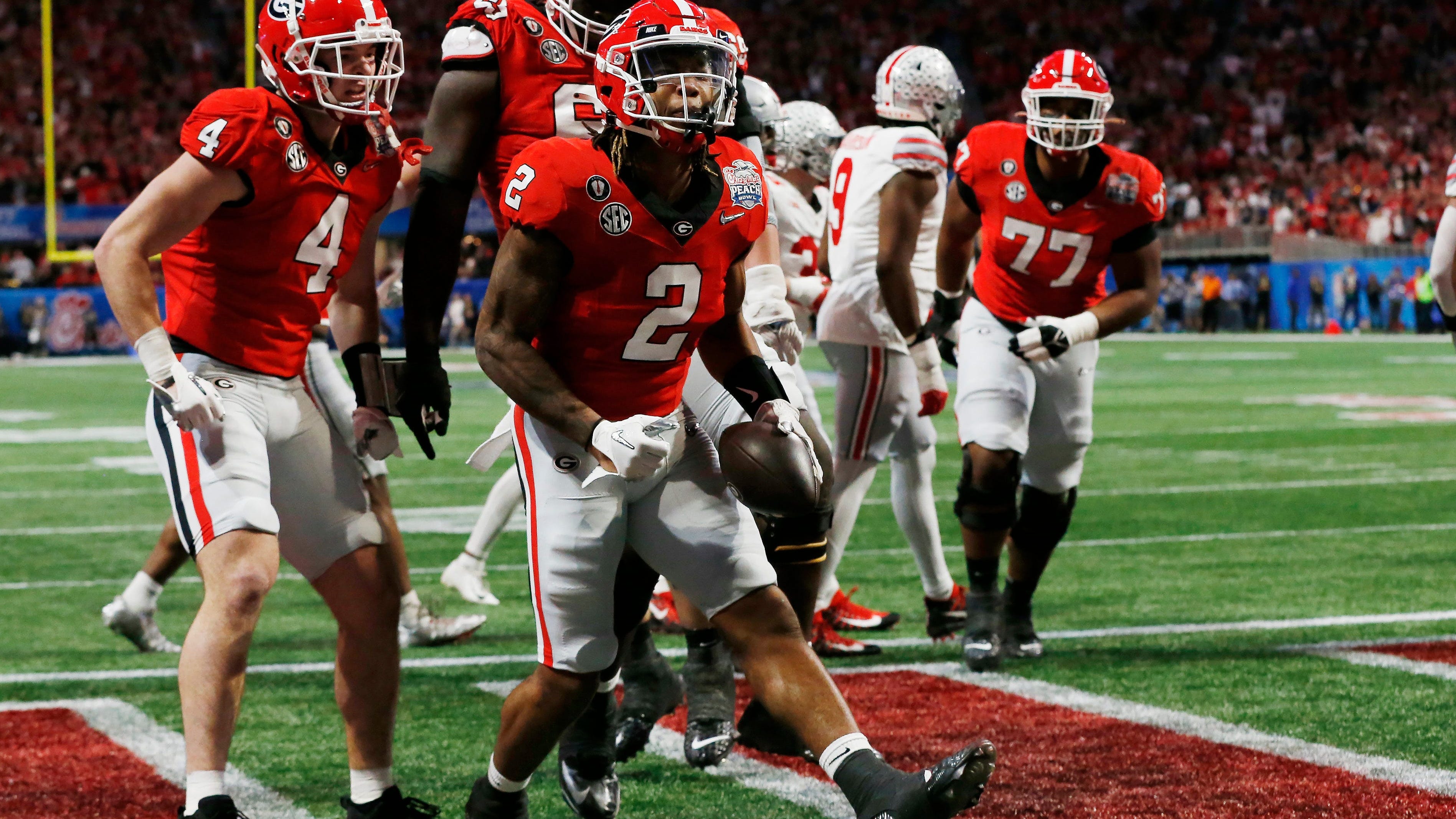 Georgia running back Kendall Milton (2) celebrates after scoring a touchdown in the first half against Ohio State during the 2022 Peach Bowl.