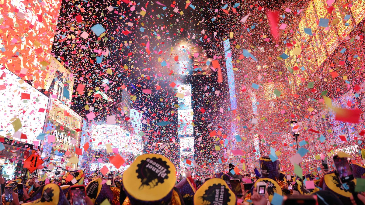 Onlookers watch as confetti fills the air to mark the beginning of the new year, in Times Square, New York City, on January 1, 2023.