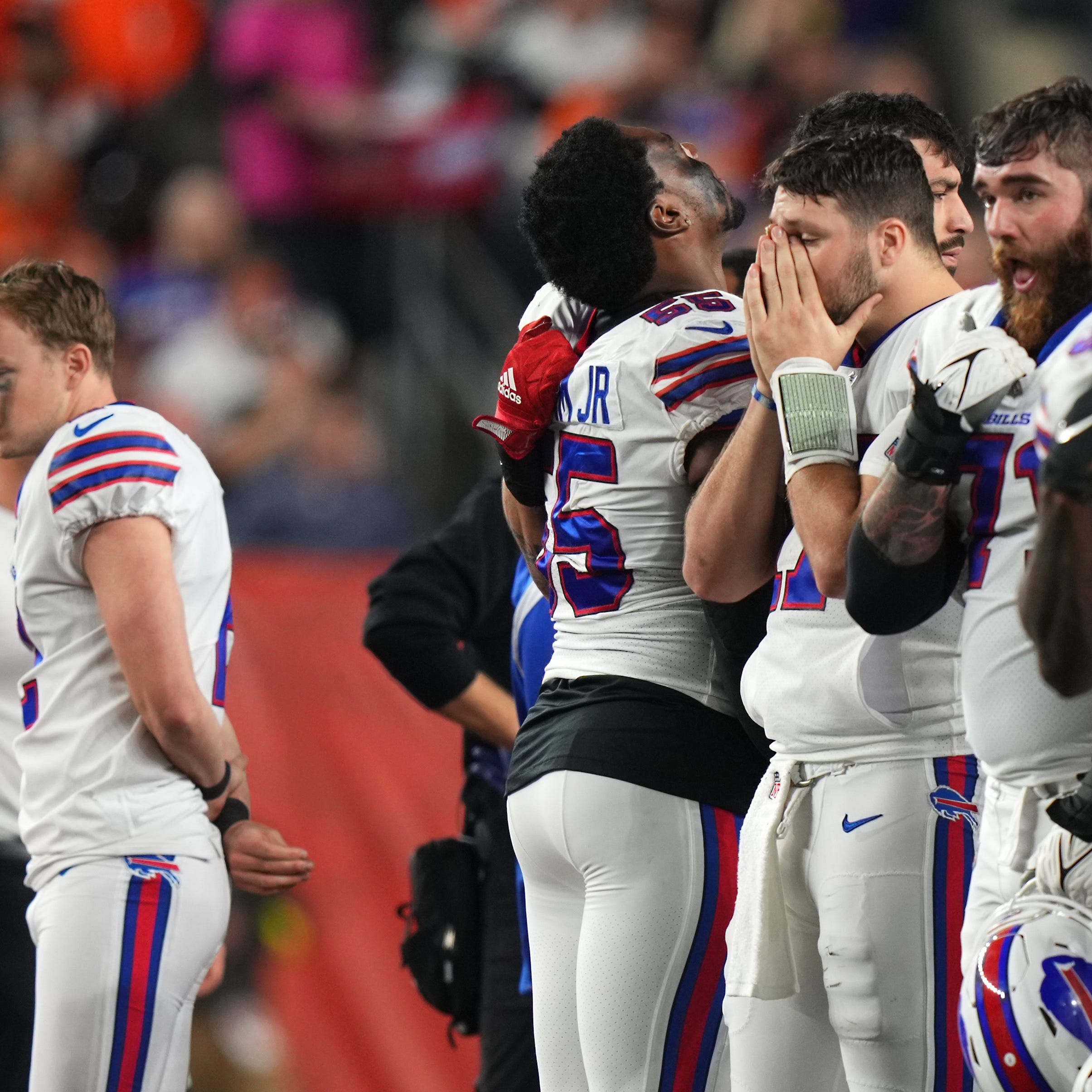 Buffalo Bills quarterback Josh Allen (17) and the Buffalo Bills react as Buffalo Bills safety Damar Hamlin (3) is tended to on the field after a collision in the first quarter of a Week 17 NFL game against the Cincinnati Bengals, Monday, Jan. 2, 2023, at Paycor Stadium in Cincinnati.