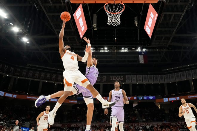 Texas point guard Tyrese Hunter shoots Kansas State forward Keyonte Johnson in the second half.  Hunter, a sophomore, led the Longhorns with a career-high 29 points.