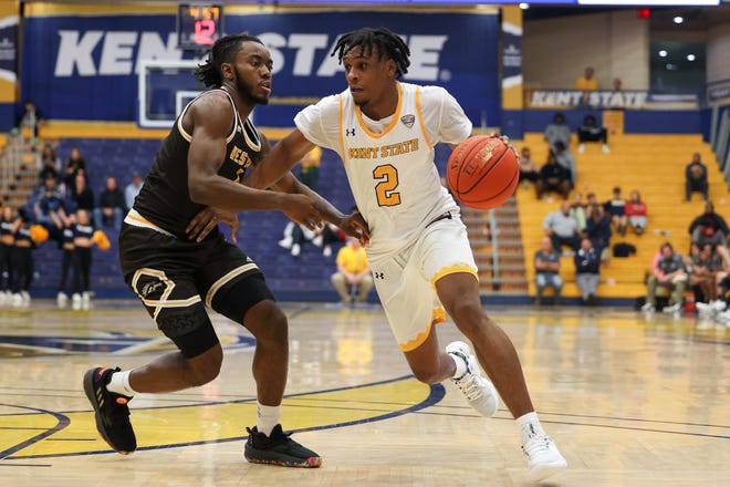 Kent State guard Malique Jacobs, who scored 17 points to help lead the Golden Flashes to a win Friday at Ohio, drives inside on Western Michigan guard JaVaughn Hannah on Tuesday at the Kent State M.A.C. Center.