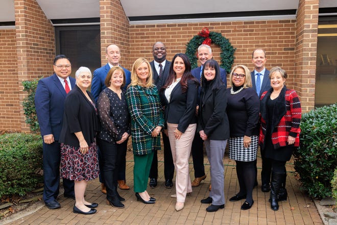 Pictured (from front left) is the leadership team at Holy Angels including Louise Pernisi, Elena Benedict, Kerri Massey, Pam Glass, Paula Atkins, Carol Petropulos, Louise Green, Mike Giang, Shawn Flynn, Donnie Thurman, Tim Cascio, Todd Garrett and (not pictured) Sonia Sandford.